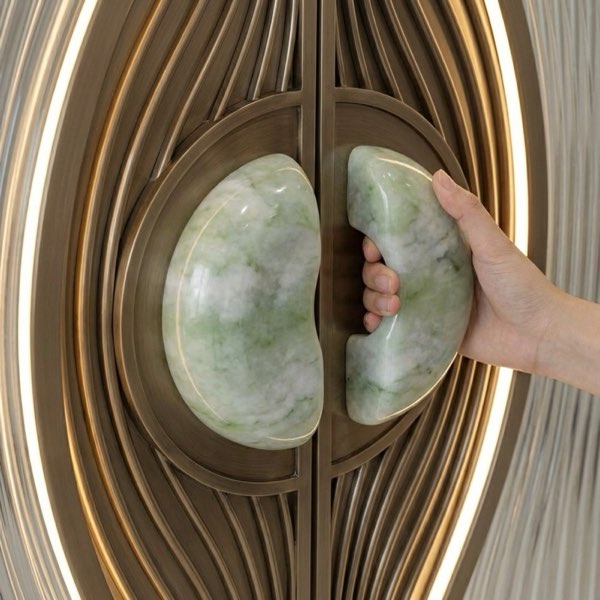 Peacock: a jade and brass door pull, made for the room